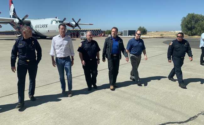 Gov. Gavin Newsom and Gov. Arnold Schwarzenegger Tour Cal Fire Equipment At McClellan Airport